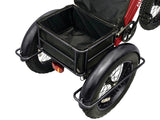 The 33 liter drybag is included in the large rear basket on the Red electric Fat Trike